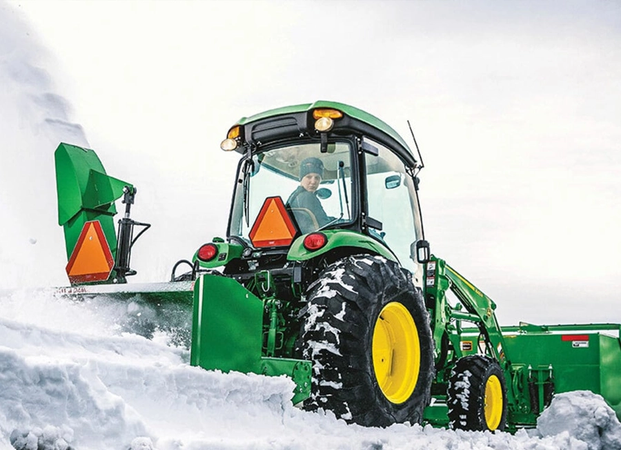 John Deere 4066R Compact Tractor Moving Snow